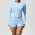 Detail of light blue yoga set featuring a zip-up cropped jacket and high waist shorts - Sky Blue