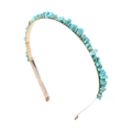 Detail of turquoise style stones wrapped on a slim gold metal headband base - Blue Green