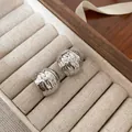 Elegant s925 silver pearl stud earrings with vintage hammered texture in a jewelry box - Pleated C-Shaped Metal Earrings - E4780 Silver
