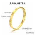 Detail showing 58x6mm gold stainless steel evil eye bangle with rhinestones - Gold