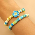 Set de pulseras de arcilla polimérica azul y amarillo con flor de frangipani degradada - Pulsera de Flores Degradada Azul Cielo