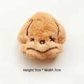 Detail view of 7x7cm fluffy brown plush dog pin with cute embroidered facial expressions - Octopus
