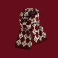 Close-up of red and white diamond knit scarf with soft texture on red background - Three-Color Argyle Knit / Burgundy
