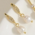 Macro detail of gold freshwater pearl earrings with shimmering zircon crystal accents - ES2303-5 Full Zircon Freshwater Pearl Earrings