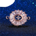 Rose gold oval jewelry connector with clear baguette zircons on starry blue backdrop - Rose Gold Oval Center Zirconia (L0656-B)