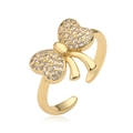 Anello elegante con fiocco dorato e zirconi lucenti con fascia aperta regolabile - Stile CE00847YH / Oro