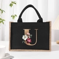 Black canvas tote bag with floral golden letter U print and jute trim decoration - Bronze Floral Letter U