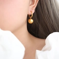 Golden round hoop earrings with sphere charm pendant in polished titanium steel for women - Gold Color Hoop Earrings