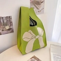 Green knitted tote bag with white bow pattern shown in a minimalist home setting - 20*35cm / Light Green Bow