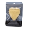 Macro detail of heart-shaped yellow cleansing sponge with lanyard in clear packaging - Heart Shaped / Yellow