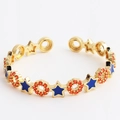 Gold open ring with blue enamel stars and orange zircon stones in a star-circle band - Star Royal Blue