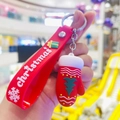 Christmas keychain with red silicone wristband and glove pendant featuring a green tree - Mitten Pendant