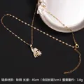 Rotating gold bear pendant necklace in titanium steel with cubic zirconia stones - Bear Holding Flower Style (A699)