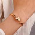 Exaggerated vintage gold-plated snake cuff bracelet with textured scales and black eyes - Gold Tone Open Snake Bangle (A-525)