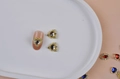 Golden heart nail art charms with sparkling crystals on artificial nails for bridal manicure - Vintage Embossed Gold Hollow Heart
