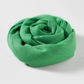 Lightweight green cotton linen blend scarf rolled into a soft flower shape on white background - 100*195CM / Dark Green