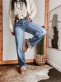 Detail van een high-waist jeans met wijde pijpen, retro omslag en centrale naad - S / Lichtblauw