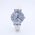 Macro detail of quartz watch dial with heart illustration and white leather strap - Off White