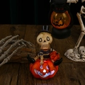 Scheletro luminoso su zucca con occhi brillanti per decorazione di Halloween - Motivo di Teschio