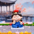 Blue traditional Tang dynasty style girl figurine in sitting pose with red flower - Playing Chess