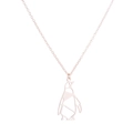 Close-up of rose gold origami penguin pendant with hollow geometric design and chain - Penguin / Rose Gold