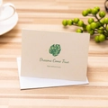Beige textured folding greeting card with green monstera leaf and 'Dreams Come True' text - Dreams Come True / With Envelope