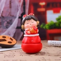 Cute Chinese doll figurine in red finish holding a golden koi fish ornament - 1088-44 Holding Koi Fish (Medium)