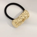 Minimalist elastic hair tie with a gold-plated hammered texture metal tube bead - Curved Embossed Pattern Gold