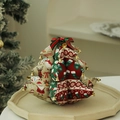 Christmas tree fabric ornament with reindeer patterns and golden bells on a platter - Red and Green Printed Fabric Christmas Tree