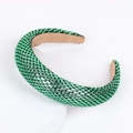 Baroque padded green headband with sparkling rhinestones on a white display base - Light Green