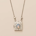 Silver celestial locket necklace with opal stone featuring star and moon motifs - Silver Vow Photo Album Necklace