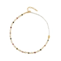 Ethnic style necklace with colorful tourmaline beads and golden spacers on white background - Colorful Hematite Patchwork Style