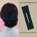 Detail view of dark green velvet bow hair bun maker showing usage and product design - Dark Green