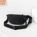 Minimalist black canvas waist bag for kids with adjustable strap and decorative zipper pull - Black