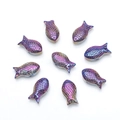 Macro view of nine iridescent fish-shaped crystal beads with metallic rainbow luster - Amethyst
