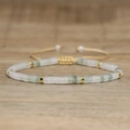 Adjustable woven bracelet with light green imperial stone beads and gold spacers - No.58 Green Jadeite