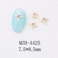 Macro detail of star-shaped nail alloy charms with pink rhinestones for DIY nail art - Gold Large Pink Rhinestone Style (A425)