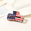 Detail of a rectangular hair claw clip featuring a glossy American flag stars and stripes pattern - US Flag Clip - 8.5cm Square