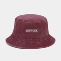 Macro detail of wine red washed cotton bucket hat with white New York embroidery - One Size / Burgundy