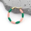 Close-up of bamboo-style earrings with pink and green enamel on golden stainless steel - Green