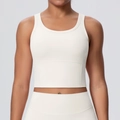 Close-up of cream sports bra featuring a U-neck design and supportive wide hemline - S / Light Ivory