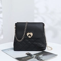 Classic black crossbody bag with gold heart lock and quilted pattern on delicate chain - Black