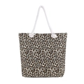 Large leopard print canvas tote bag with white rope handles on a white background - Leopard Print