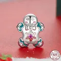 S925 sterling silver gingerbread man charm with pink stone and Christmas snowflake motifs - Gingerbread Man