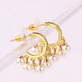 Golden hoop earrings with pearl tassels and crystal accents displayed on a clear stand - 18K Gold / Gold