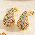 Macro view of gold teardrop earrings with colorful pavé cubic zirconia and metal butterfly backs - Colorful Zirconia