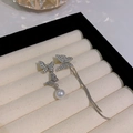 Asymmetric bow earrings with silver tassel, sparkling crystals and white round pearls - Asymmetric Butterfly Pearl Tassel (HSLE5933 Silver)