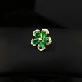 Elegant green petal brooch with gold trim and crystal accents on black leather - Green Floral