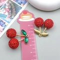Red cherry rhinestone keychain pendant with gold stem on a pink measuring ruler - Medium Clay Green Leaf Cherry (23746)