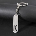 Polished silver stainless steel keychain featuring a hollow-out letter K pendant - Letter K